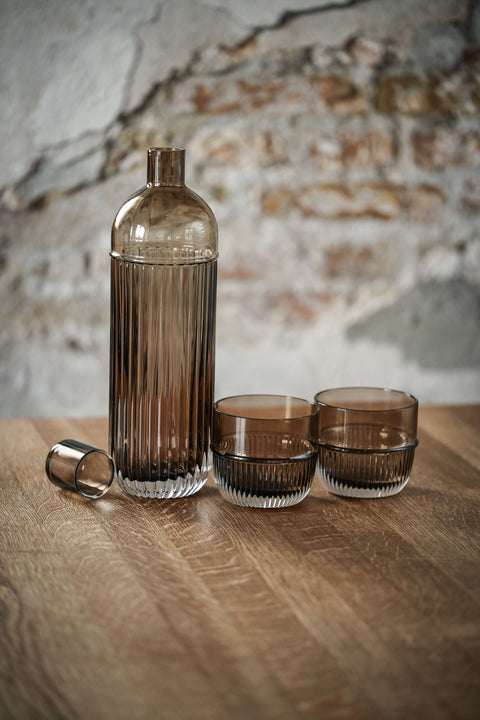 Table Noir carafe and tumbler in smoked crystal glass designed by Rikke Malling